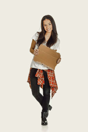 Young woman holding a cardboard.の写真素材