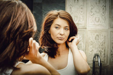 Woman take care of her beauty.の写真素材