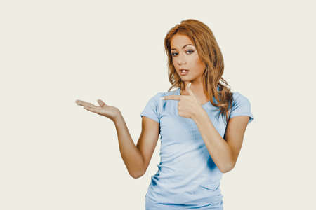 Young woman presenting a product.の写真素材