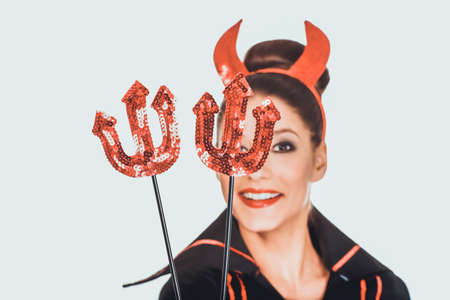 Woman in devil carnival costume.の写真素材