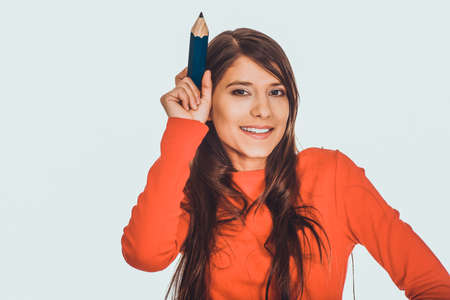 Beautiful young with a big pencil.の写真素材