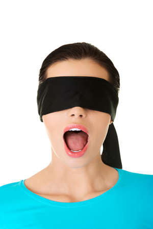 Confused blindfolded womanの写真素材