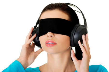 Confused blindfolded woman on a white backgroundの写真素材