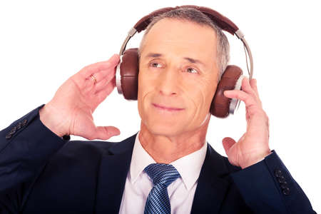 Businessman with big headphonesの写真素材
