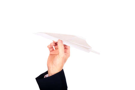 Close up on male hand throwing a paper planeの写真素材