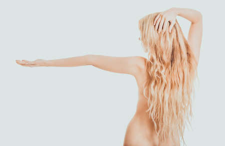 Topless student woman hodling copyspaceの写真素材