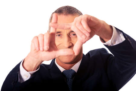Portrait of businessman gesturing frameの写真素材