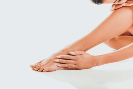 Naked woman sitting curled upの写真素材