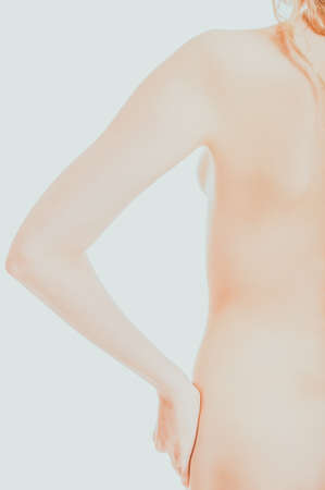 Topless woman with hand on hipの写真素材