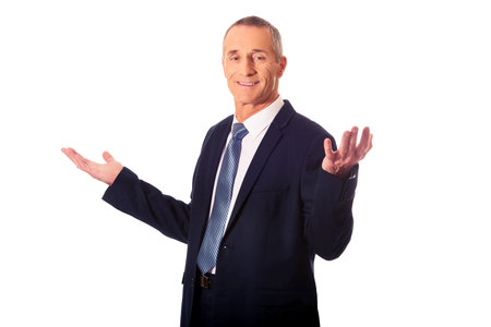 Businessman with open hands in undecided gestureの写真素材
