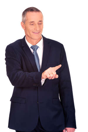 Businessman pressing an abstract buttonの写真素材