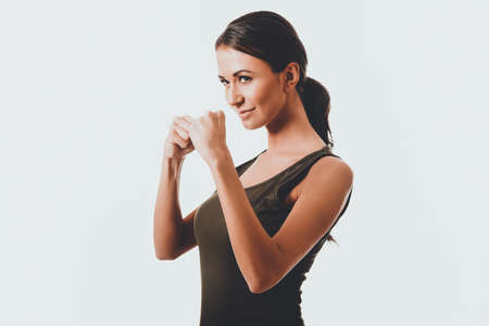 Woman in military clothes boxingの写真素材