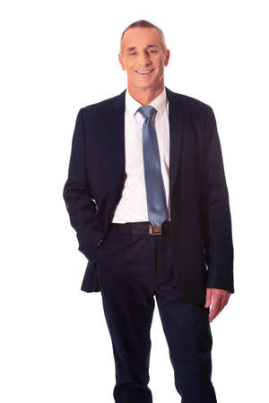 Smiling businessman with hand in pocketの写真素材