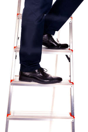 Close up male legs climbing ladderの写真素材