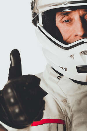 Man in driver costume with thumbs upの写真素材