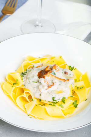 Pasta with cream sauce with chanterelle.の写真素材