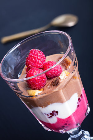 Glass of chocolate and rapsberry dessertの写真素材