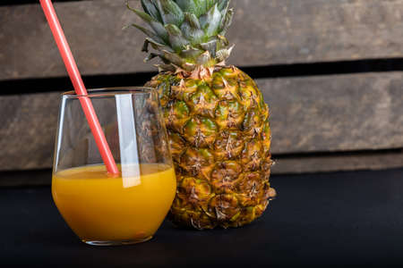 Fresh pineapple and glass with pineapple juice.の写真素材