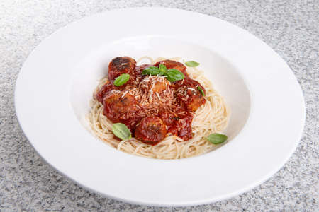 Pasta with meatballs and tomato sauce.の写真素材