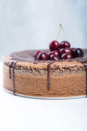 Chocolate cake with juicy cherries.の写真素材