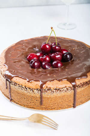 Chocolate cake with juicy cherries.の写真素材