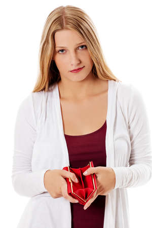 Young woman shows her empty wallet. Bankruptcyの写真素材