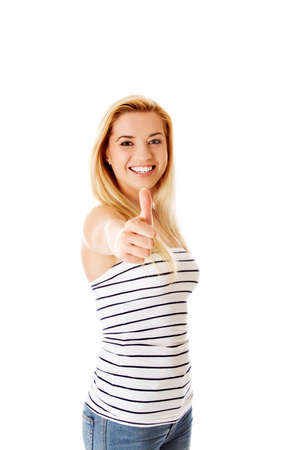 Girl shows ok gesture isolated on white.の写真素材