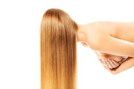 Beautiful long blonde hair, isolated on white background.の写真素材