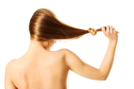 Girl with ong blond human hair, isolated on white.の写真素材