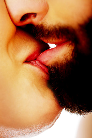 Happy young beautiful couple kissing.の写真素材