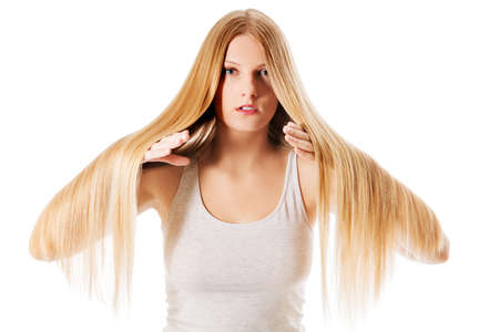 Blond hair. Beautiful woman with straight long hair.の写真素材