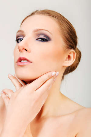 Attractive blonde topless woman with dark eye make upの写真素材