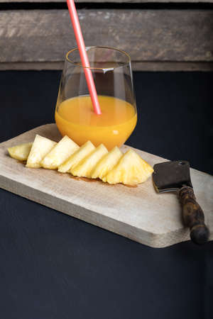 Fresh pineapple and glass with pineapple juice.の写真素材