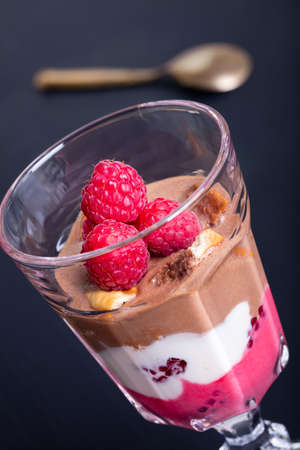 Glass of chocolate and rapsberry dessert.の写真素材