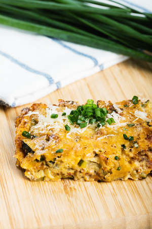 Vegetables casserole with cheese and chives.の写真素材