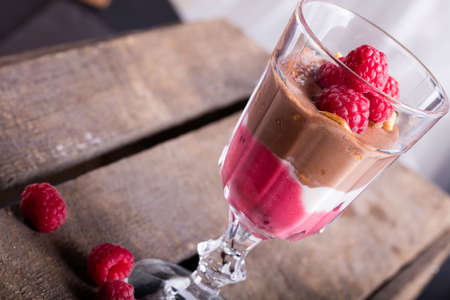 Glass of chocolate and rapsberry dessert.の写真素材