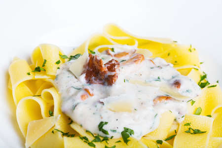Pasta with cream sauce with chanterelle.の写真素材