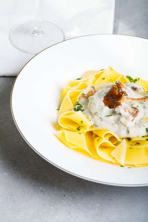 Pasta with cream sauce with chanterelle.の写真素材