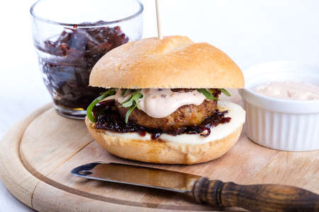 Hamburger with onion chutney and cheese.の写真素材