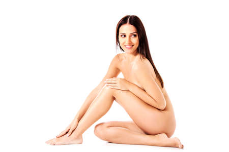 Young nude woman sitting on the floorの写真素材