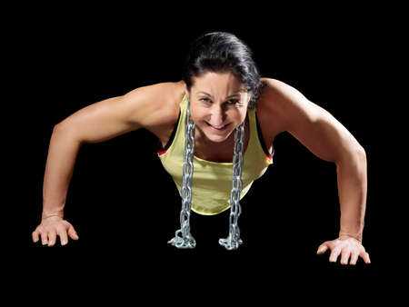 Muscular bodybuilder woman showing her muscles.の写真素材
