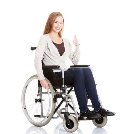 Beautiful caucasian woman sitting on a wheelchair.の写真素材