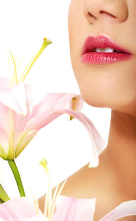 Beautiful woman's lips and lily flower.の写真素材