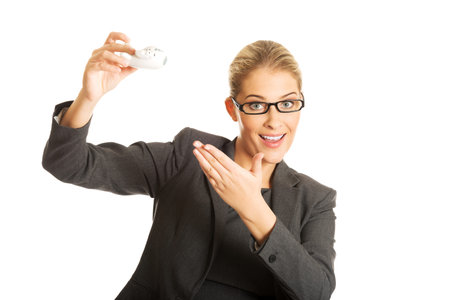 Businesswoman with plane toy in handの写真素材