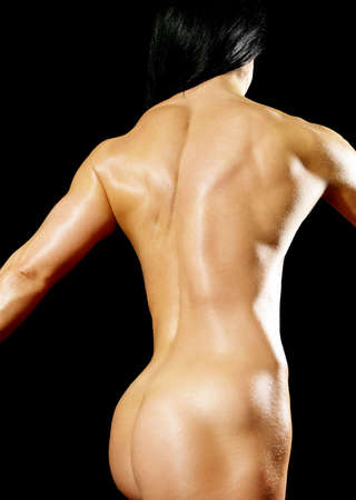 Muscular bodybuilder woman showing her muscles.の写真素材