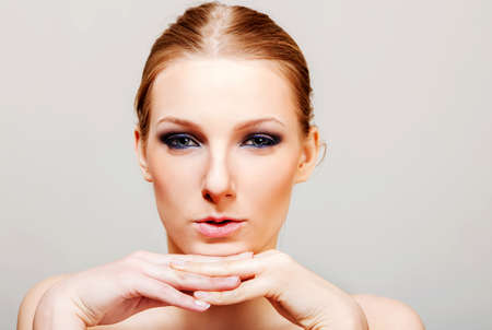 Attractive blonde topless woman with dark eye make upの写真素材