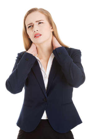Beautiful caucasian business woman touching her neck.の写真素材