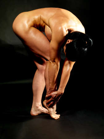 Muscular bodybuilder woman showing her muscles.の写真素材
