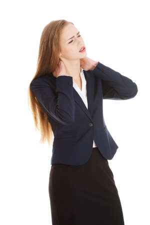 Beautiful caucasian business woman touching her neck.の写真素材