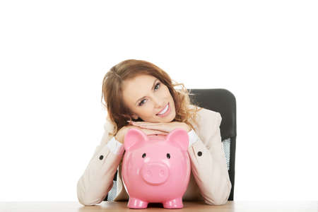 Business woman with a piggybank.の写真素材
